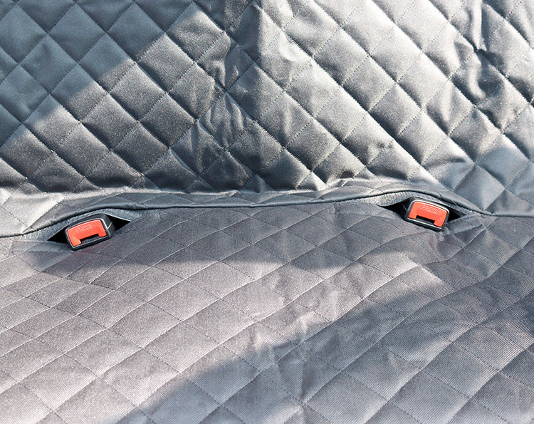 Gray quilted car mat with red clips