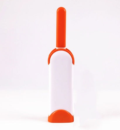 White and orange pet grooming tool