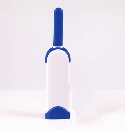 White and blue pet grooming brush