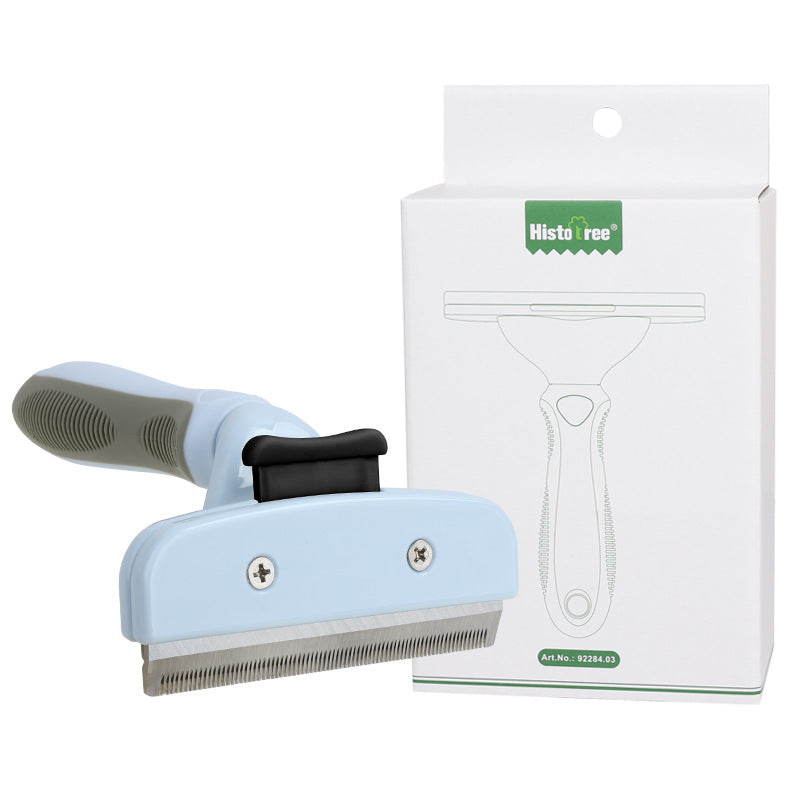 Pet grooming brush with blue handle and black bristle area, next to its packaging