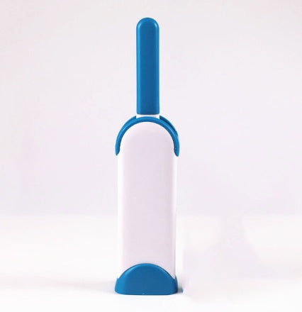 White and blue pet grooming brush