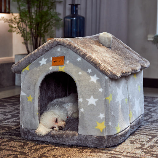 Dog lying in a star-patterned pet house