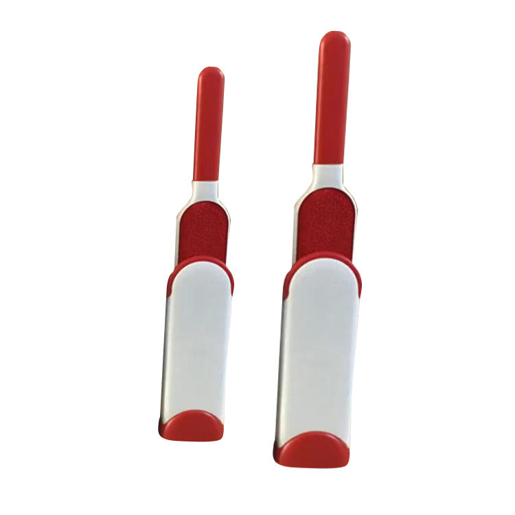 Two red and white pet grooming tools
