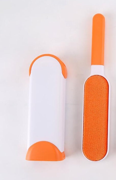 Two orange and white cleaning tools