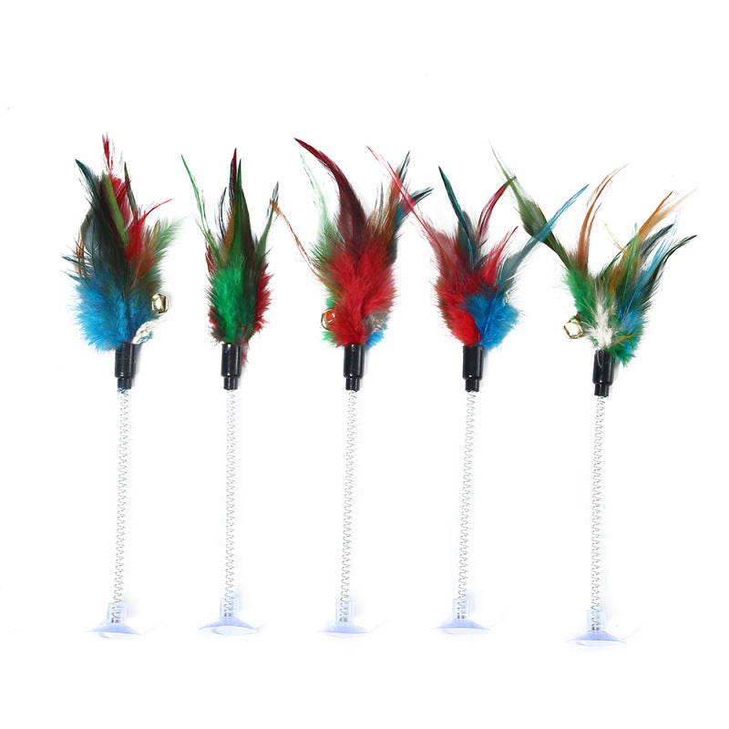Set of five colorful feather cat toys on a white background