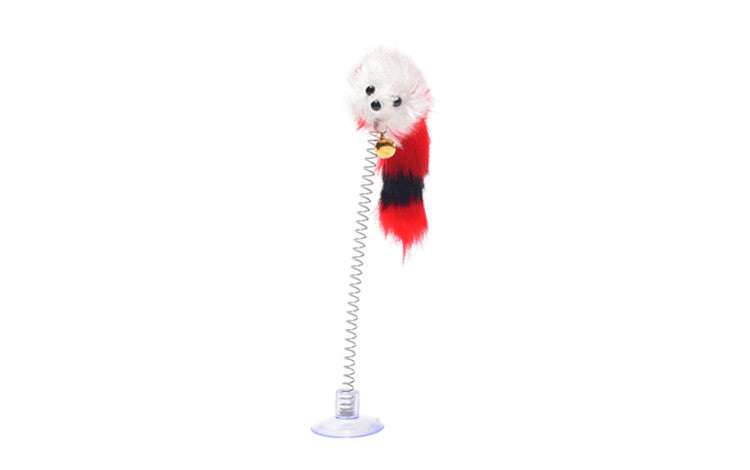 Plush dog toy with a spring on a white background