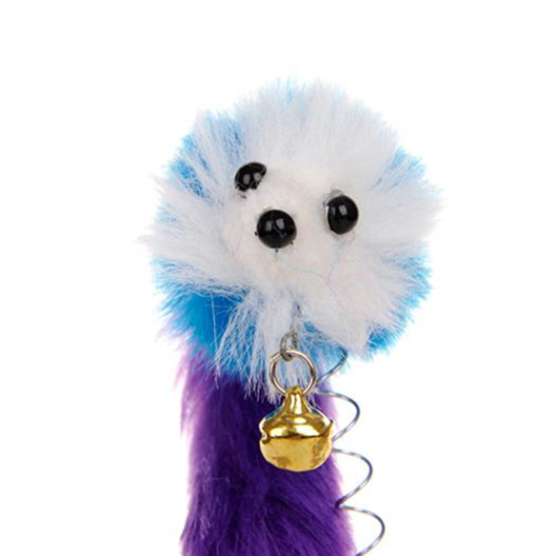 Plush toy with blue, white, and purple fur and a gold bell on a white background