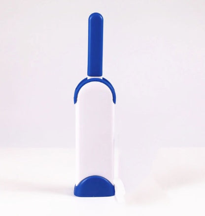White and blue pet grooming brush