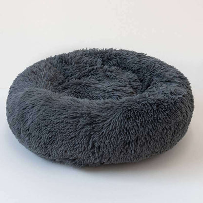 Fluffy gray pet bed on a white background