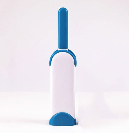 White and blue pet grooming brush