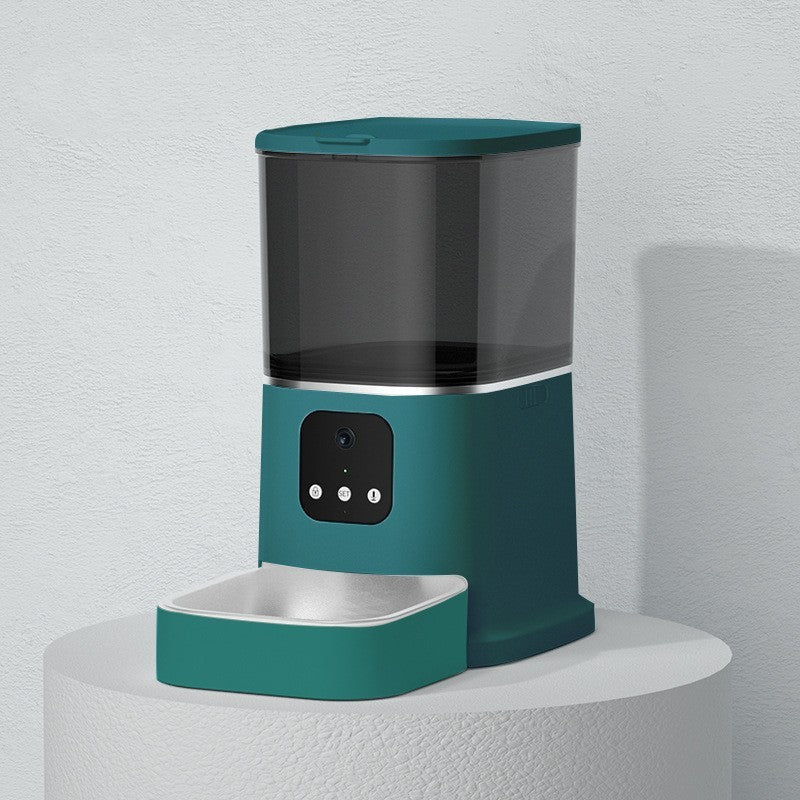 Teal pet water dispenser on a white pedestal against