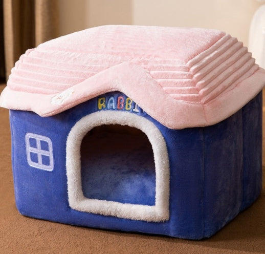 Blue pet house with pink roof