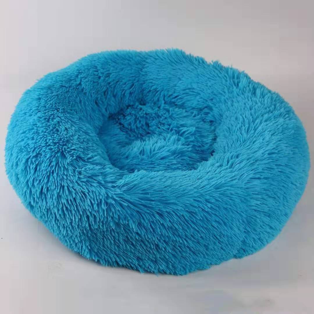 Blue fluffy donut pet bed on a white background