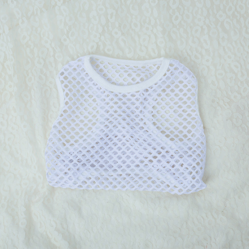 White mesh top on a light beige background
