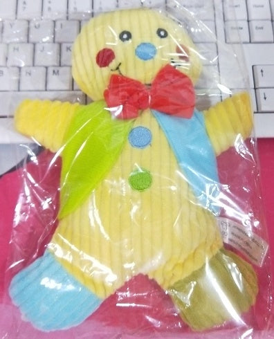 Colorful toy figure in a clear plastic bag on a keyboard background