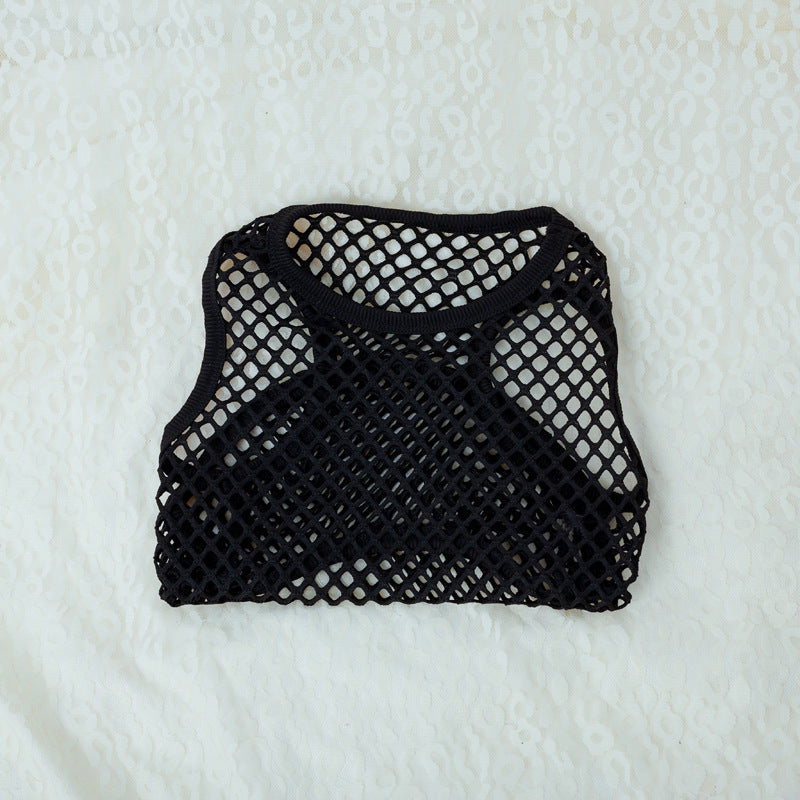 Black mesh bag on a textured white background