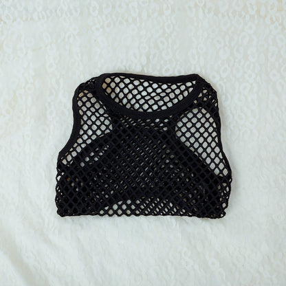 Black mesh bag on a textured white background