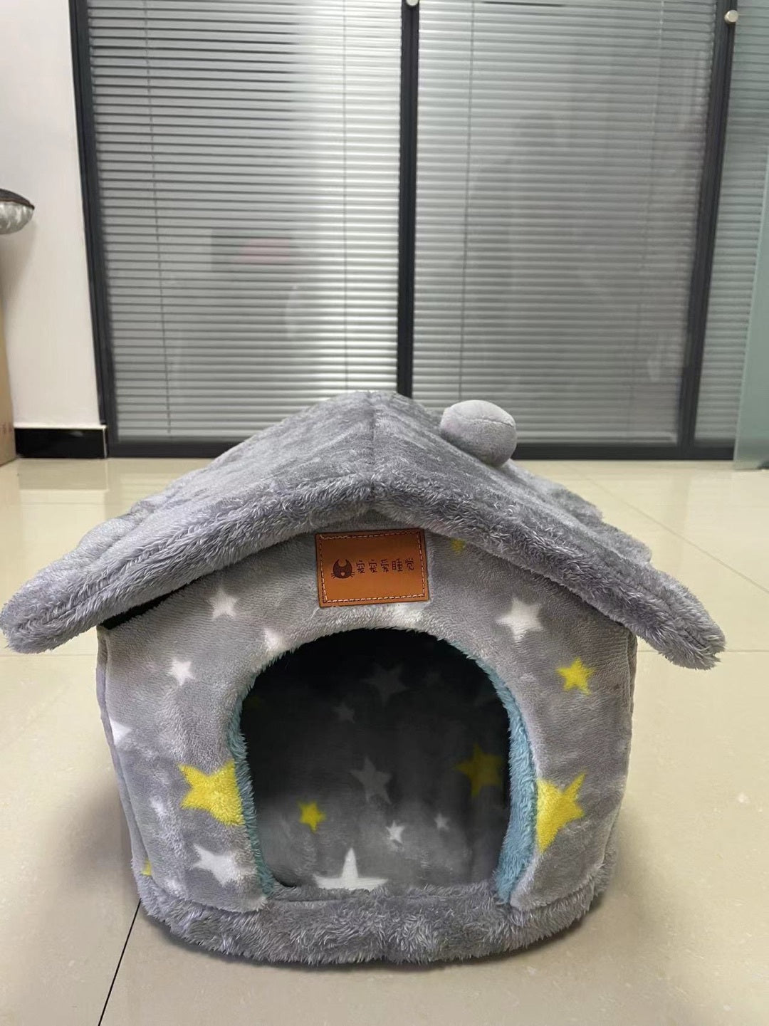 Gray pet bed with star pattern