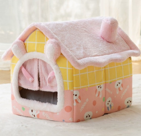 Pink and yellow pet house with cartoon designs