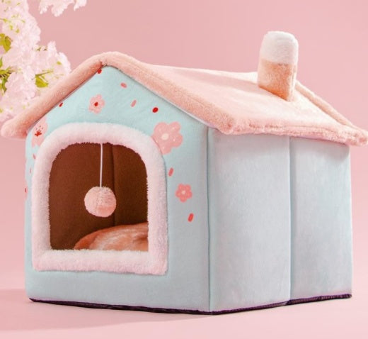Pet house with pink roof and floral patterns